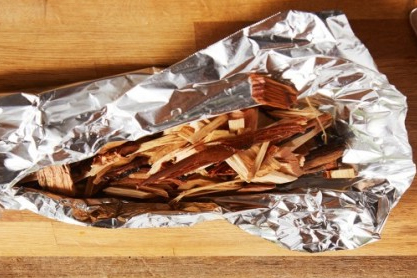 Placing Wood Chips In Aluminum Foil/ Can